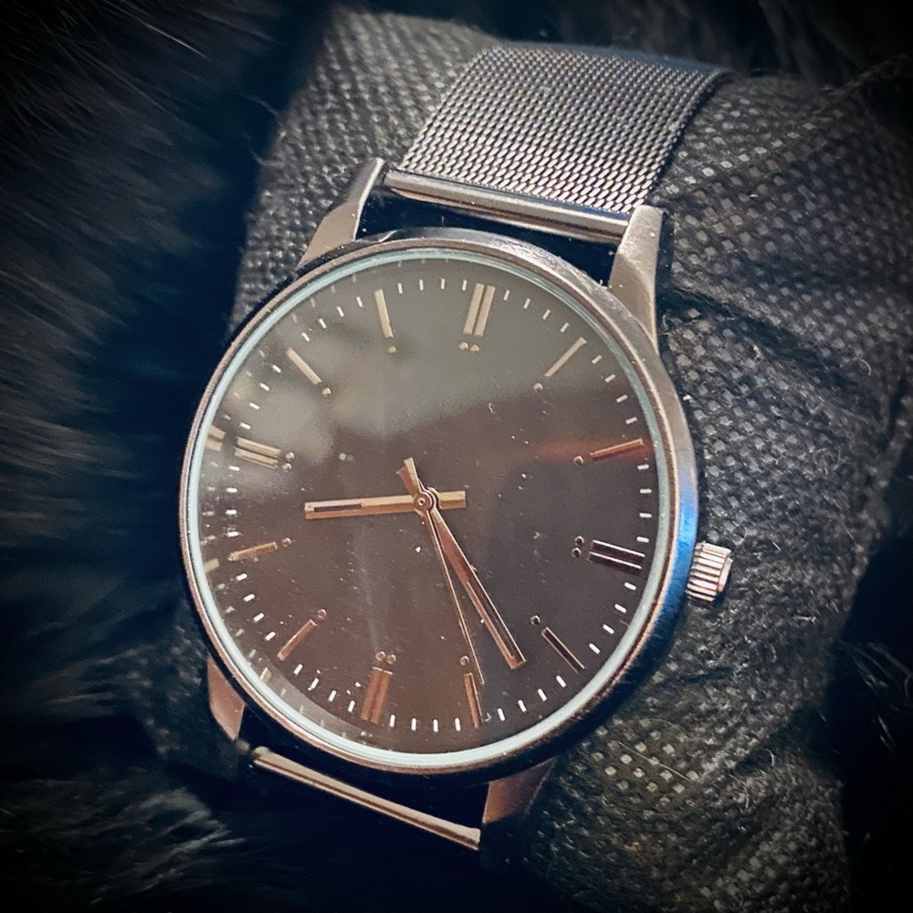Black Metal watch with band.